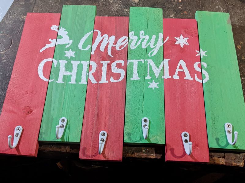 red-and-green-stocking-holder-five-white-hooks-merry-christmas-reindeer