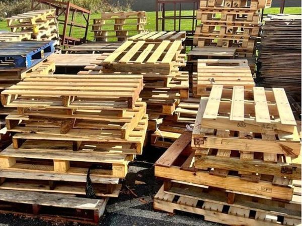 stacked wood pallets outdoors